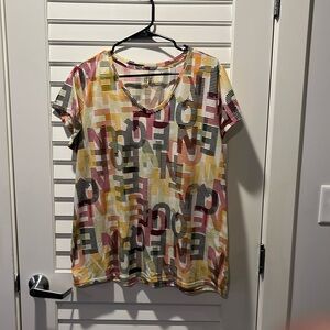 Multi colored t-shirt. The letters spell Queen.